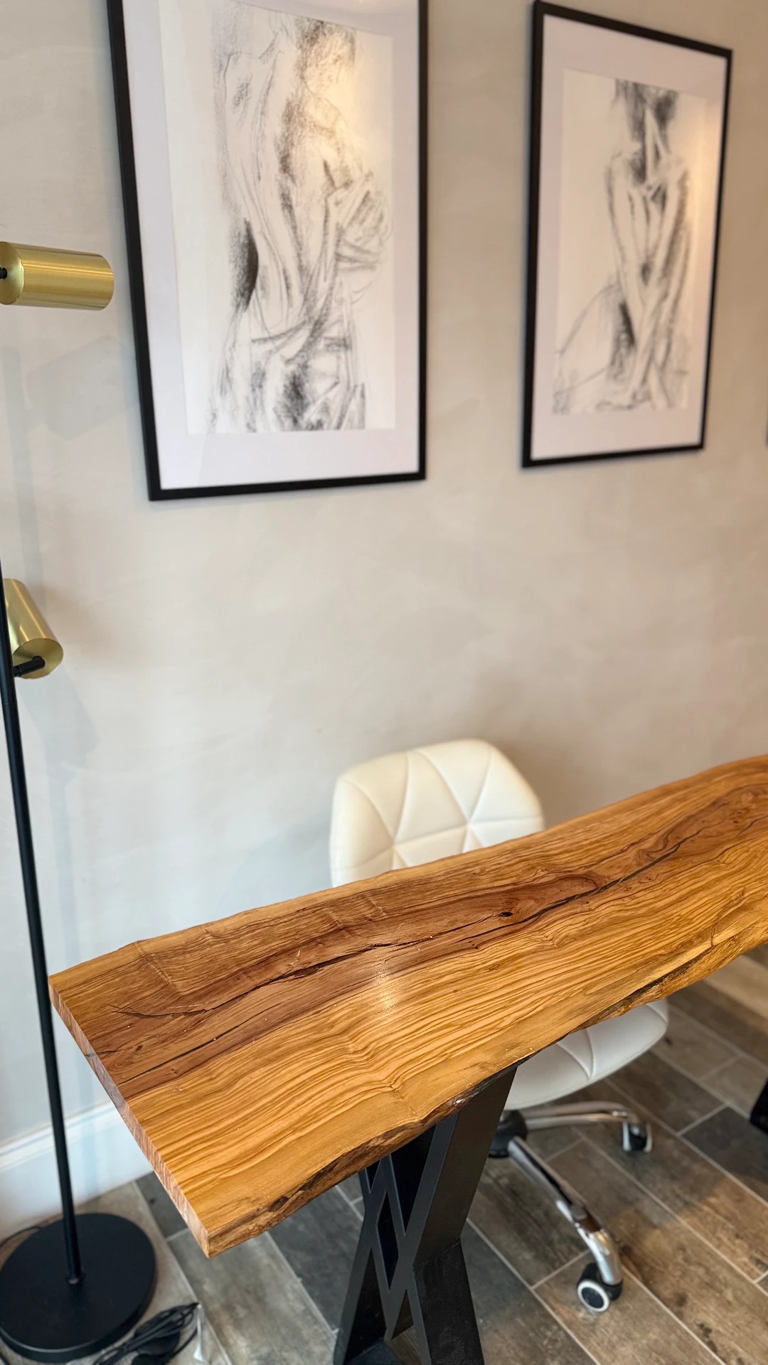 Live-edge olive-wood consultation desk at Canopy Skin Studio in Corringham